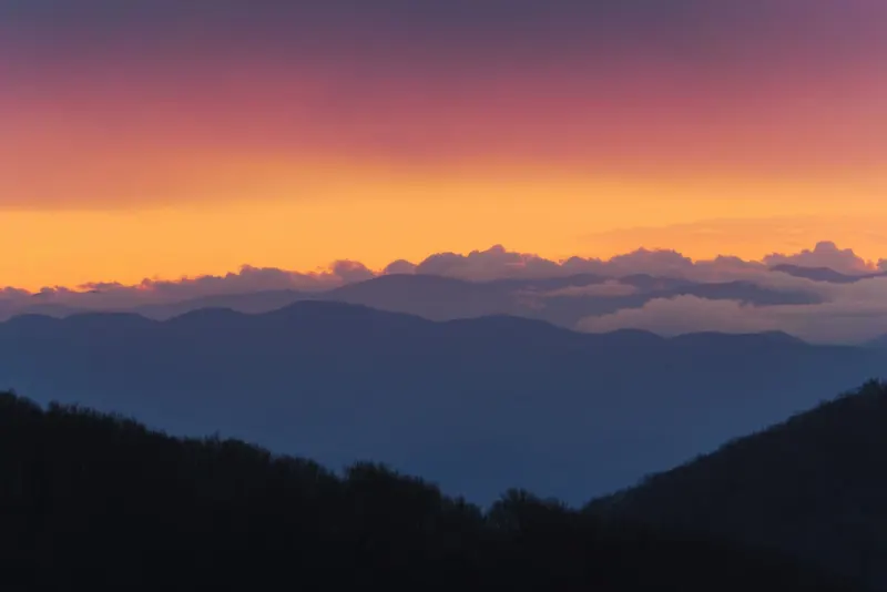 Layered mountain ridges at dusk